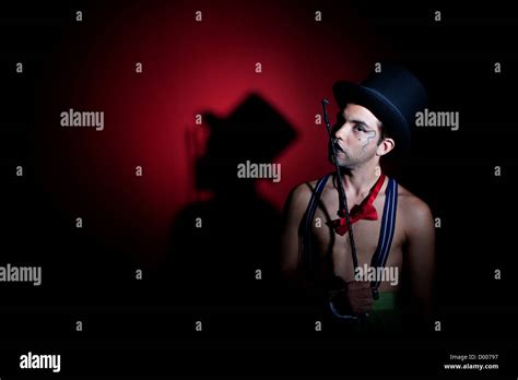 Man in top hat with shadow on the wall Stock Photo - Alamy