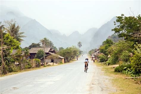 Daily Life of Vang Vieng Village with Limestone Mountains, Laos Stock Photo - Image of green ...