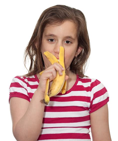 Young girl eating a banana stock photo. Image of hungry - 13770564