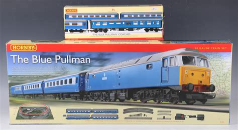 A Hornby gauge OO R.1093 The Blue Pullman train set and an R.4310 The Blue Pullman coach pack, both