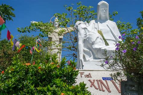 White Maria Statue with Jesus Christ Monument in the Background in Vung ...