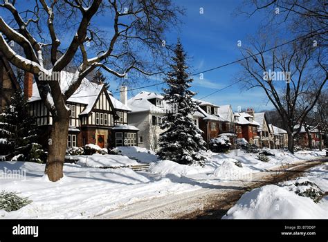 Suburban street with snowy houses, Canada or United States Stock Photo - Alamy