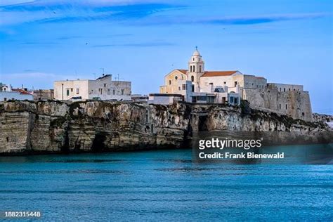 The church Chiesa di San Francesco and white houses of the small town ...