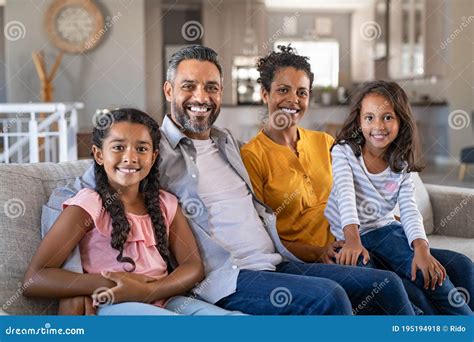 Happy Multiethnic Family Sitting Together Stock Photo - Image of child ...