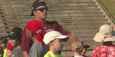 Aggie football players host football clinic with Boys & Girls Club