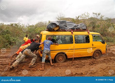 Pushing The Car Out Of Mud Editorial Stock Photo - Image: 25980778