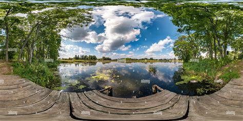 360° view of full seamless spherical hdri panorama 360 degrees angle view on wooden pier among ...