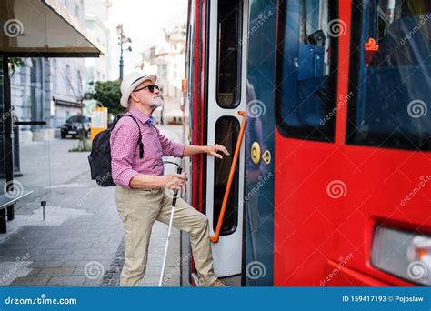 Senior Blind Man with White Cane Getting on Public Transport in City ...