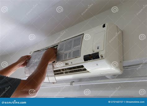 Technician Service Cleaning and Washing Maintenance or Repairing Air Conditioner on the Wall ...