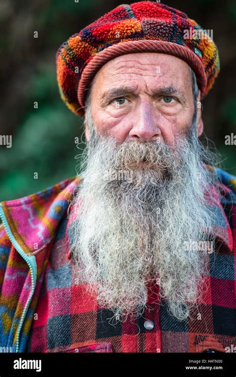 Character mountain man with a long beard Alps Stock Photo - Alamy