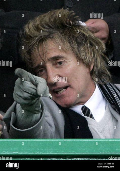 Singer Rod Stewart watches the Bank of Scotland Premier League match between Celtic and Rangers ...