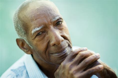 Closeup of happy old black man smiling at camera
