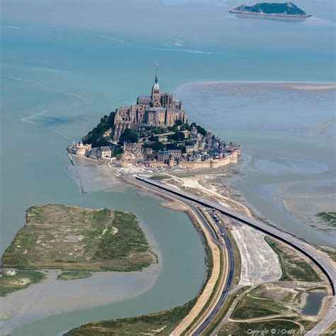 The tiny island of Mont Saint-Michel in Normandy, France, with its ...