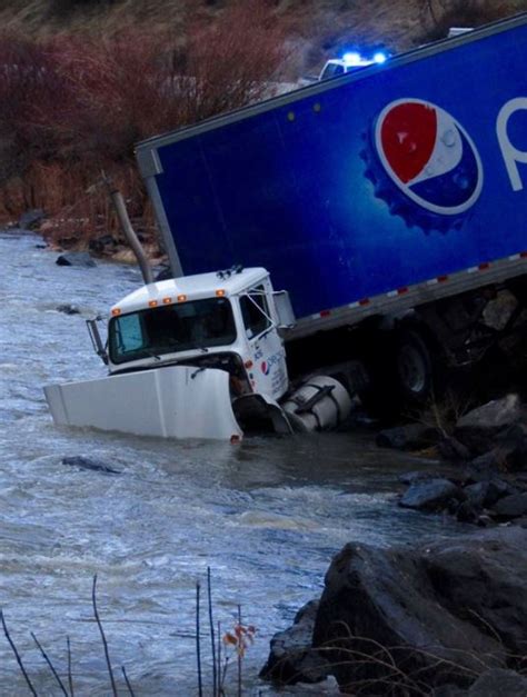 Photos: Pepsi semi truck crashes into Mores Creek along Highway 21 | KVAL