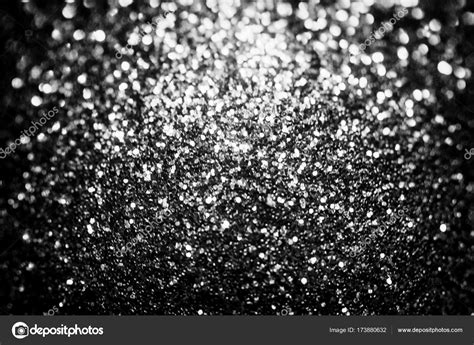Black glitter sparkle background. Black friday shiny pattern with sequins. Christmas glamour ...