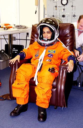 Mission Specialist Kalpana Chawla is helped suiting up for Terminal Countdown Demonstration Test ...