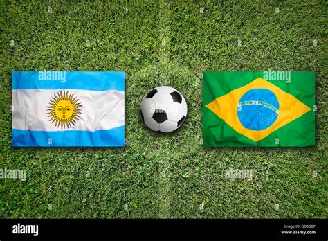 Argentina vs. Brazil flags on green soccer field Stock Photo - Alamy