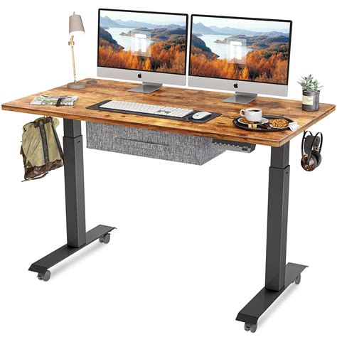 FEZIBO Standing Desk with Drawer, Adjustable Height Electric Stand up Desk, 48 x 24 Inches Sit ...