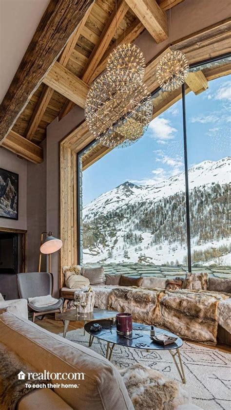 Modern Cabin Living Room with Snowy Mountain Views