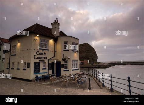 Sunset over the Cod and Lobster Pub in the village of Staithes, North Yorkshire England UK Stock ...