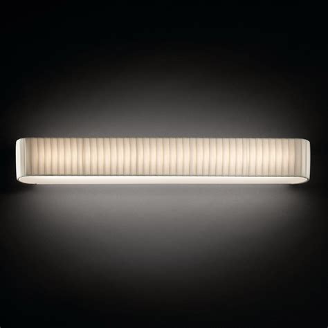 BCN Long Ribbon Wall Light is a discreet and sophisticated fixture with delicate hand-wrapped ...