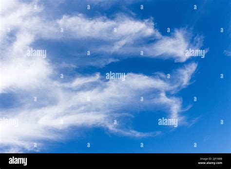 Cirrus clouds formation at blue sky Stock Photo - Alamy