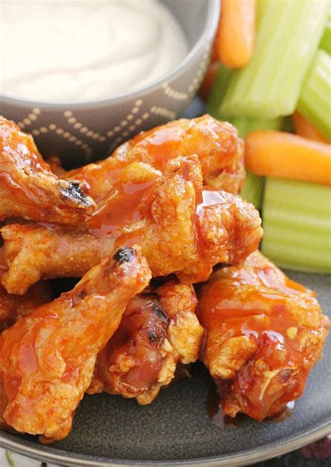 Crispy Baked Chicken Wings - with the best buffalo sauce - Foodtastic Mom