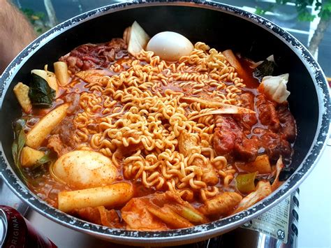 Insanely spicy and fresh, traditional Korean dish - tteokbokki with ramen noodles, fish cakes ...