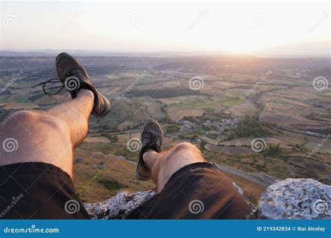 On the Edge of a Cliff during Sunrise Stock Photo - Image of farmland, nature: 219342834