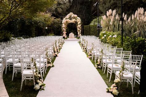 Wedding Ceremony Ideas: Flower-Covered Wedding Arch - Inside Weddings