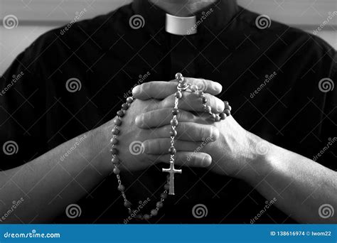 Praying Priest with Rosary Beads Stock Photo - Image of handmade, dark ...