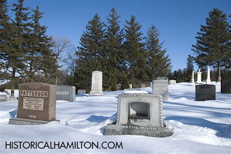 Tombstones In The Snow Within Mount Zion Cemetery at Historical Hamilton