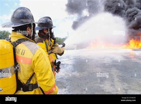 Hawaii, Oahu, Honolulu, Firefighters Put Out Fire Stock Photo - Alamy