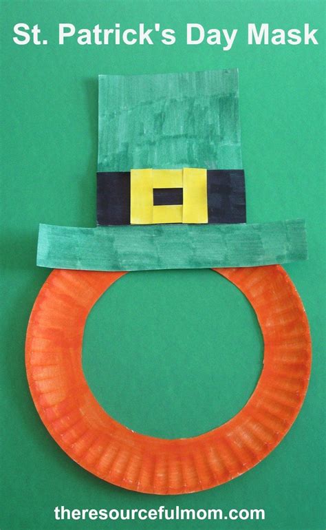 st patrick's day mask made out of construction paper and an orange ring ...