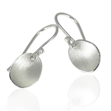 handmade silver earrings with flower petals by lilia nash jewellery | notonthehighstreet.com