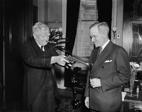 United States Vice President John Nance Garner jokingly pointing two pistols at Missouri Senator ...