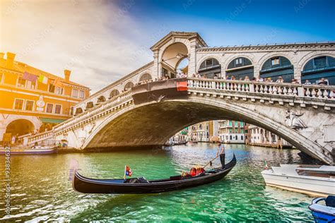 Gondola with Rialto Bridge at sunset, Venice, Italy Stock Photo | Adobe ...