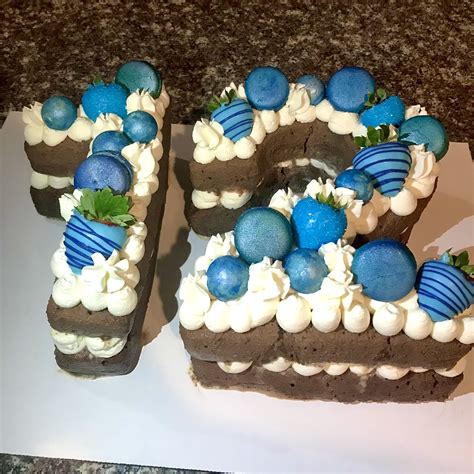 Blue themed number “12” cake, chocolate tres leches with a whipped cream frosting and topped ...