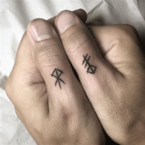 Runes on fingers - Tattoogrid.net