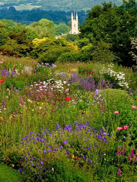 Idyllic English country garden with distant church spire - Yelverton ...