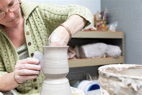 Potter working in studio - Stock Photo - Dissolve