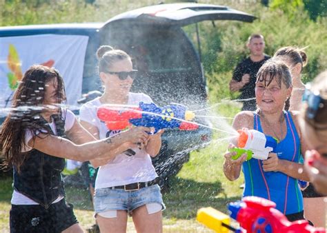 Premium Photo | Children playing water battle water game battle