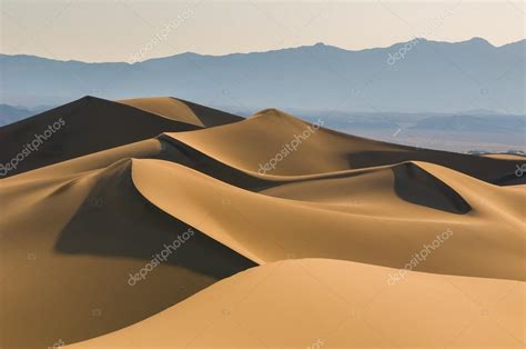 Sand dunes over sunrise sky — Stock Photo © javarman #17419087