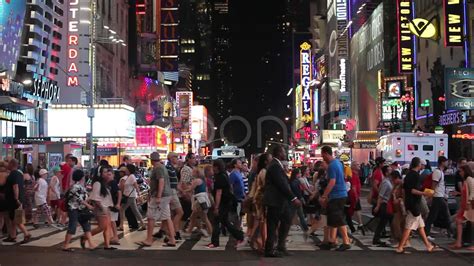 Crowd of people walking crossing street at night in Times Square slow motion 30p Stock Footage,# ...