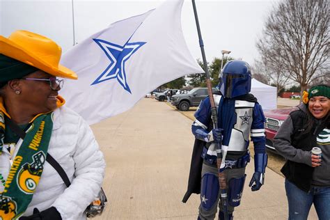 Dallas Cowboys and Green Bay Packers fans brave cold weather outside AT&T Stadium