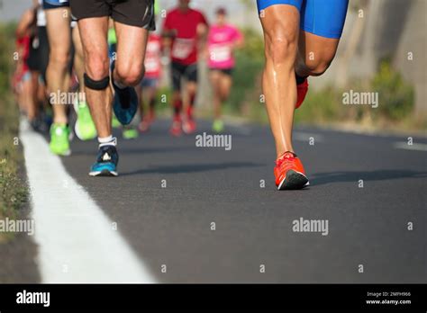 Marathon running race, runners feet on road Stock Photo - Alamy