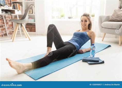 Happy Woman Exercising at Home and Relaxing Stock Image - Image of activity, person: 150090857