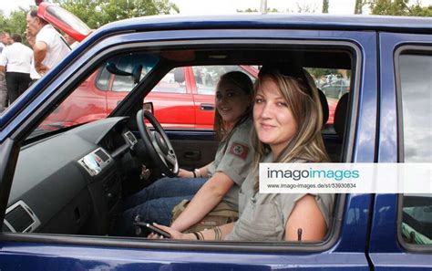 Two young women proudly wearing the swastika logo of the Afrikaner ...