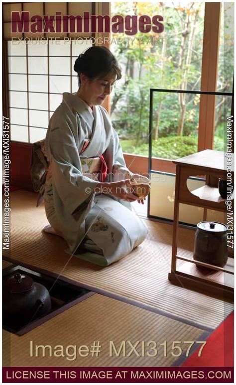 Photo of Tea ceremony master serving matcha tea in a bowl in a ...