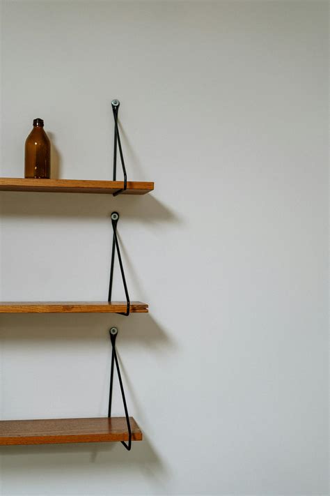 Brown Wooden Wall Mounted Rack · Free Stock Photo